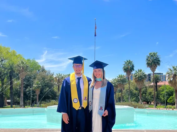 Lauren Hiett and Jared Meyer in front of old main fountain