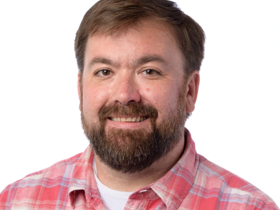 Headshot for faculty member Paul Hill