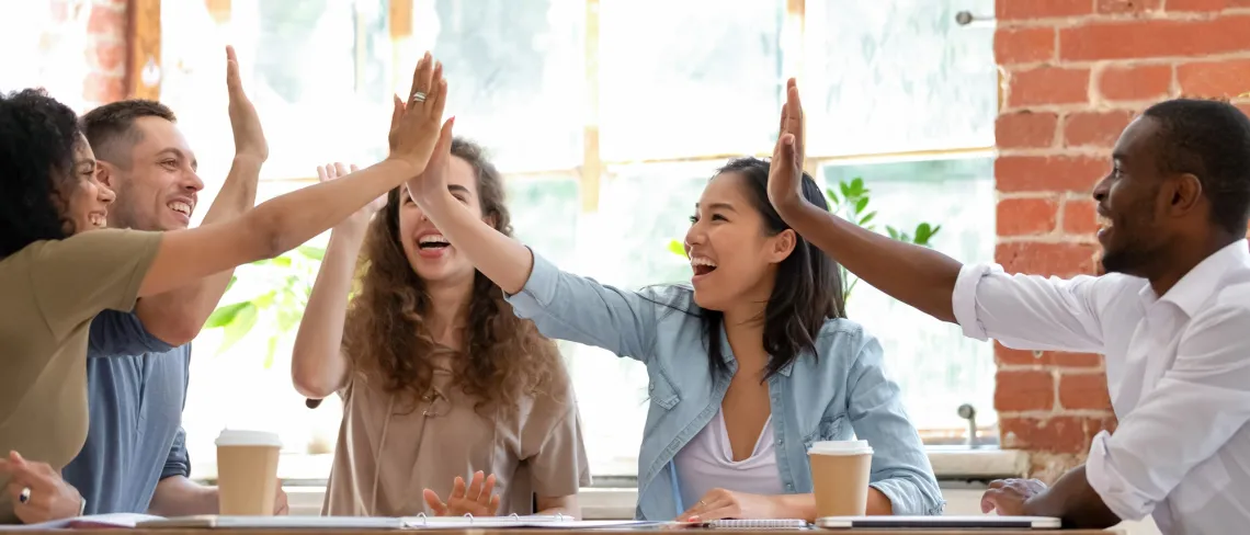 students high-fiving