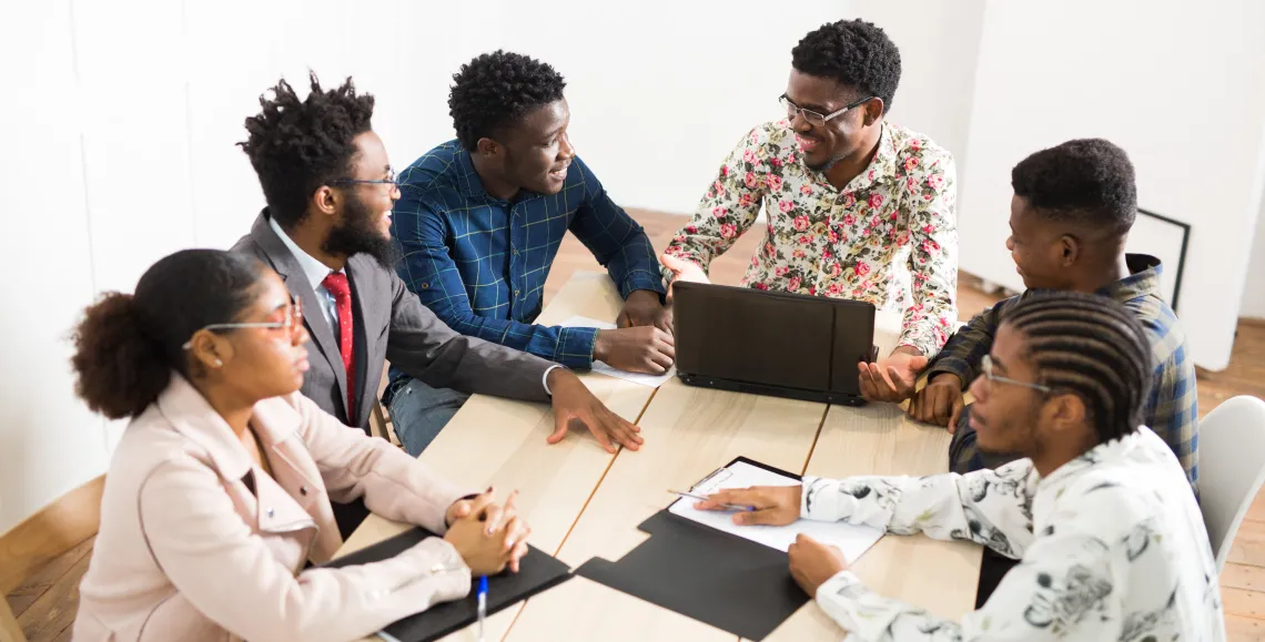 students meeting around computer