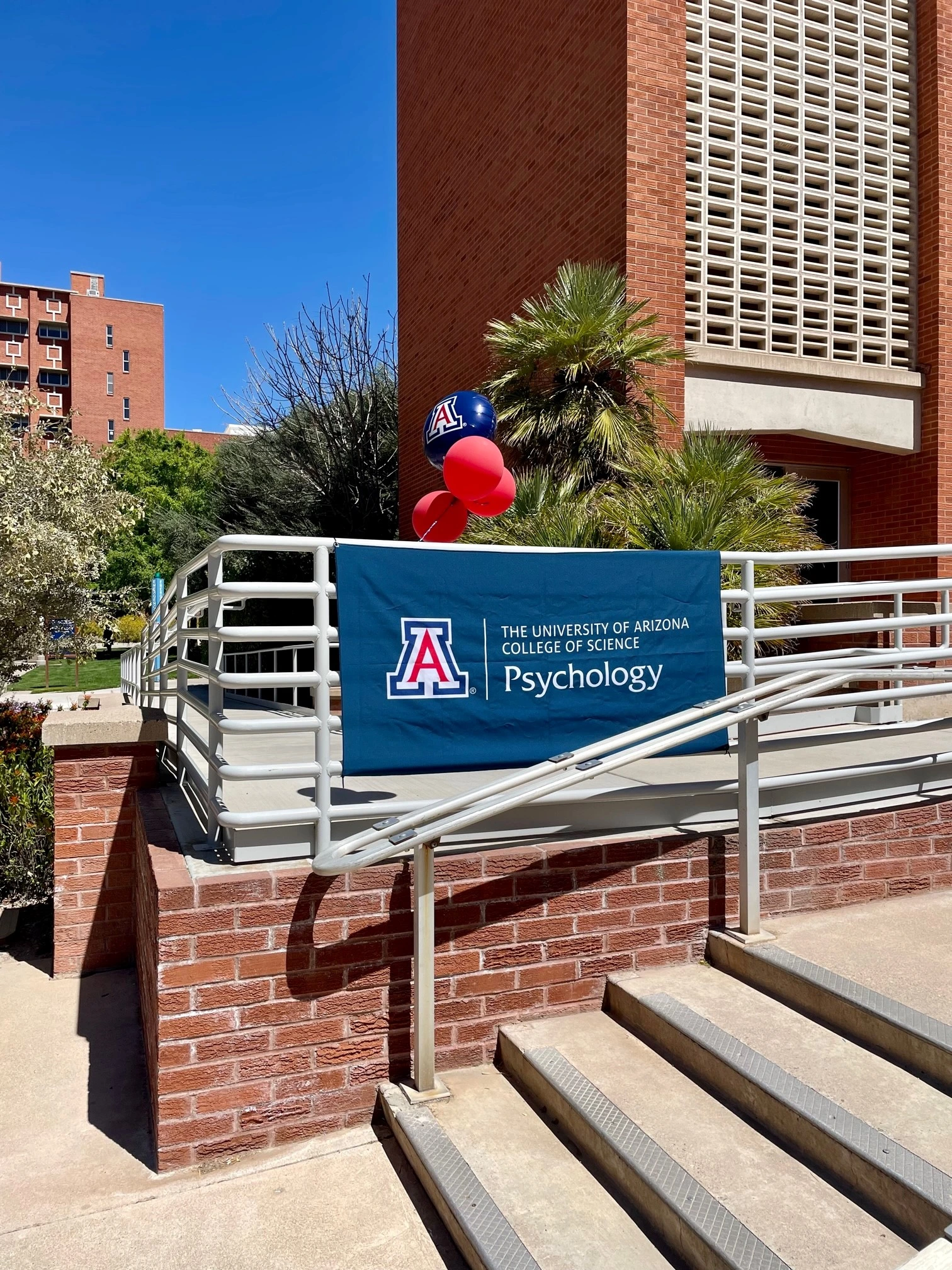 Psychology sign on railing in front of building